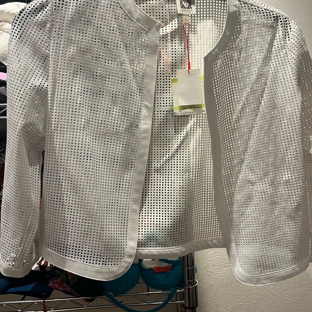 A white jacket with square whole pattern